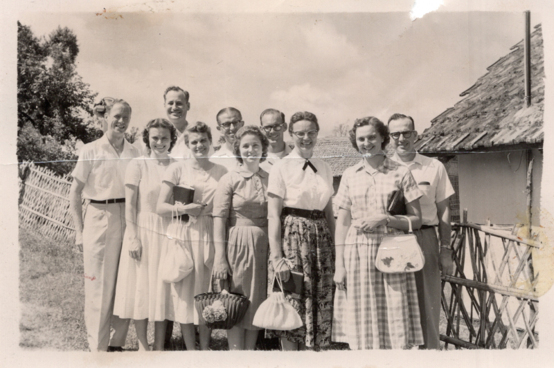 Image from the Olsons, missionaries to Pakistan, of Assemblies of God Missionaries. Back of image caption damaged, but WMC binder caption reads, "Assemblies of God Missionaries in East Pakistan, Back Row: Calvin [Olson], Orville Carlson, Charles Woolerer, Ronald Peck, Don Tarno, Front Row: Marian [Olson] Yvonne Carlson, Montiel Peck, Elsie Morialke, Ruth Tarno, Chittagong- 1961"