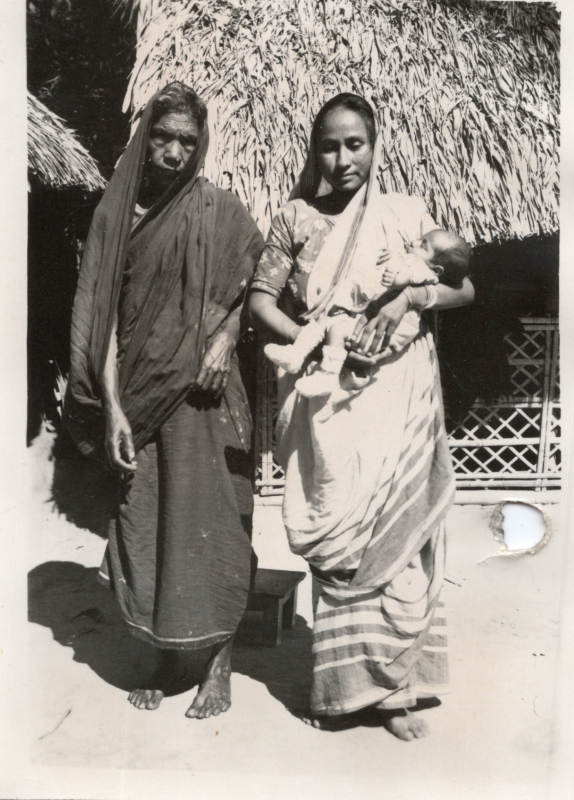 Image from the Olsons, missionaries to Pakistan, captioned,"'Lilima' in mother's arms, 'midwife' in dark sarre (see letter), I watched Lilima's first public appearance, Dec. 1962."