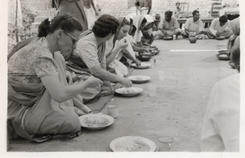 A picture from the Olsons captioned, "Missionaries and nationals eating noon meal of rice and curry at annual convention in East Pakistan. Joseph Spina and Marian on left. 1961"