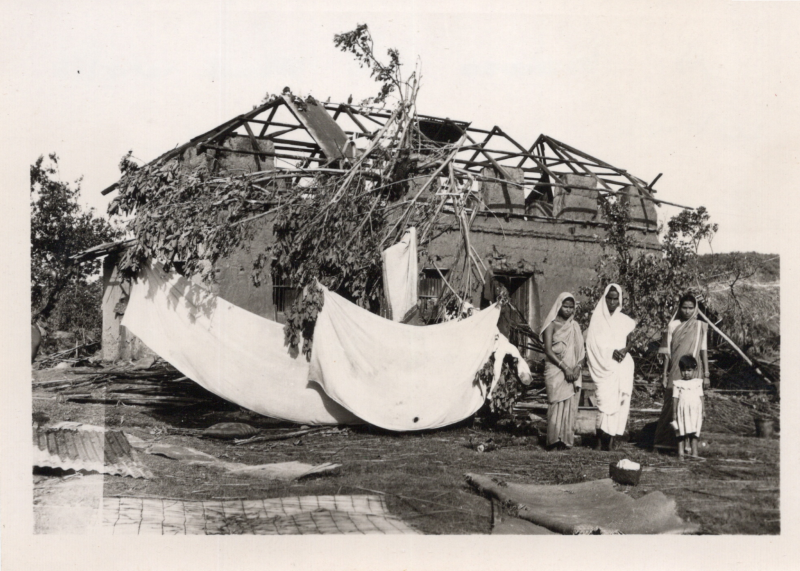 A picture from the Olsons captioned, "A house of mud walls which withstood the severe cyclone in Chittagong in June 1963. The tin roof blew off. East Pakistan"