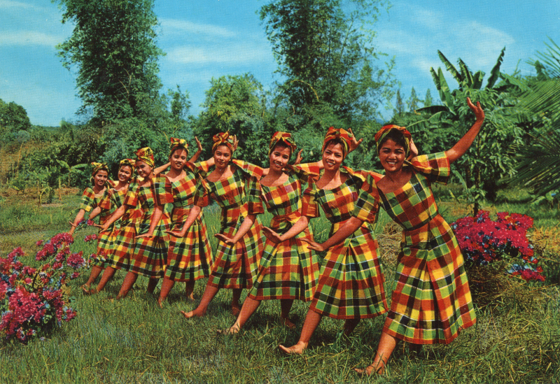 A group of women pose together on a blank postcard. The image description reads, "Itik - Itik, A native dance interpreting the playfulness of duckings wading in the river."