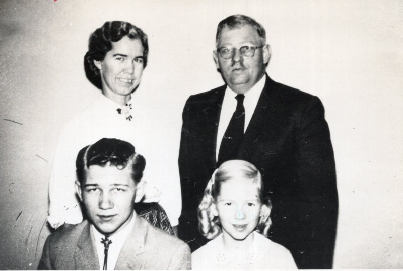 Portrait of a man, woman, boy and girl