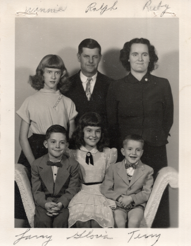 Portrait of parents Ralph and Ruby with children Winnie, Larry, Gloria, and Terry. A message on the back reads, "Greetings from the 'Buchanans,' Winnie, Gloria, Larry, Terry. Pray for us." Missions to Indigineous Americans ("American Indians")