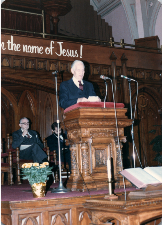A man speaks at the pulpit