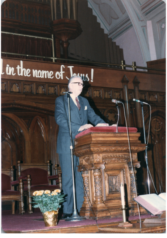 A man speaks at the pulpit
