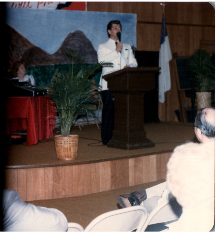 A man spaks on a stage