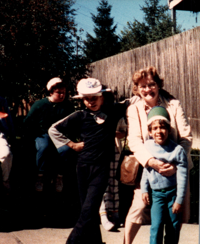Two children smile with Mrs. Bogdan