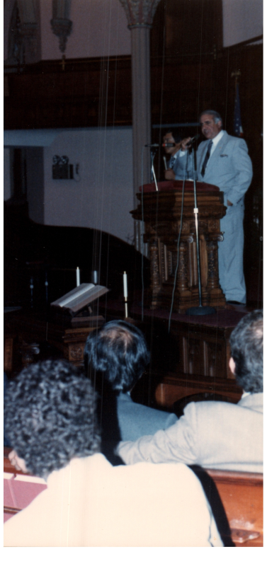 A man speaks at the pulpit