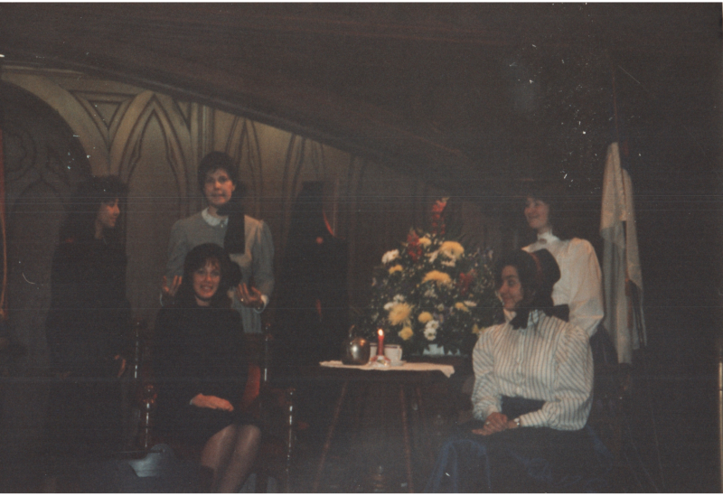 A group of women in costume on stage in the sanctuary