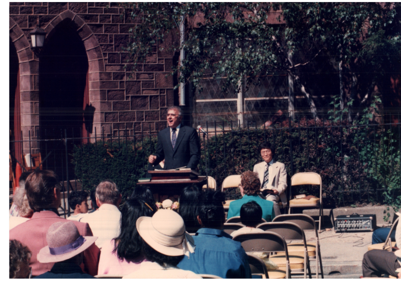 Pastor Bogdan preaches outside of the building