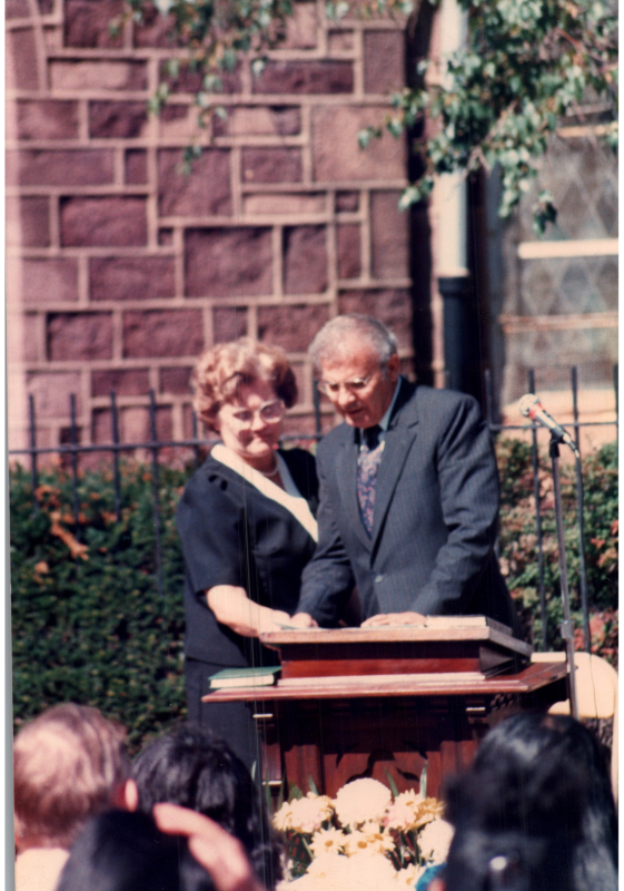 Rev. and Mrs. Bogdan read together from the outdoor pulpit