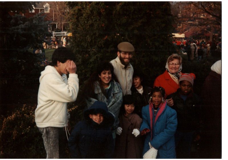 Congregants gather outside in a residential area