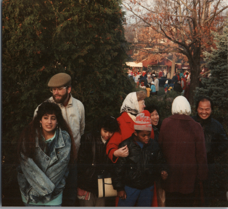 Congregants gather outside in a residential area