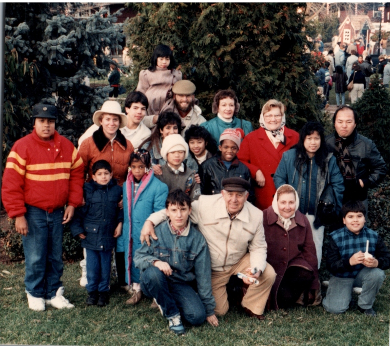 Congregants gather outside in a residential area
