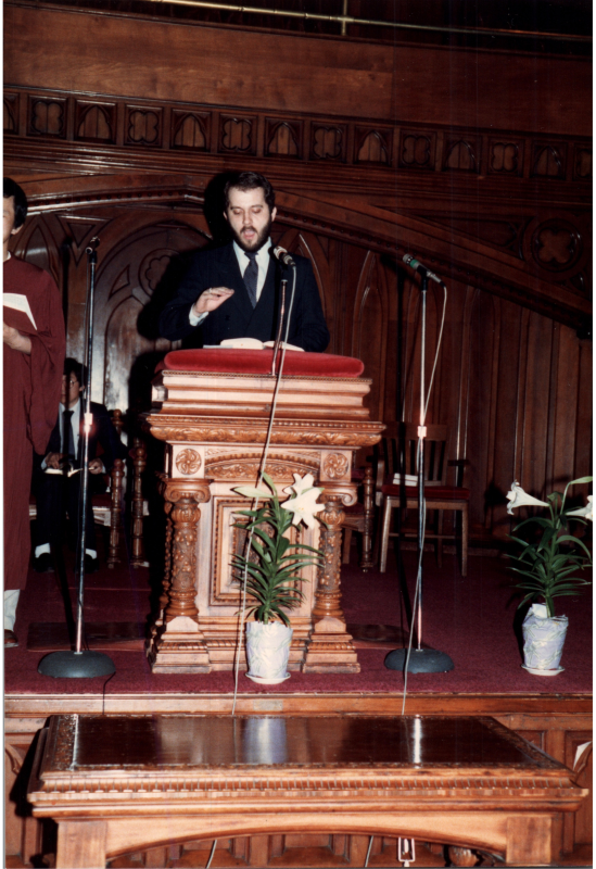 A man speaks at the pulpit