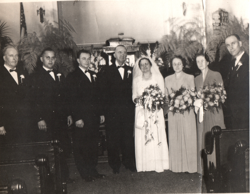 A wedding party with Rev. Bragg on the far right