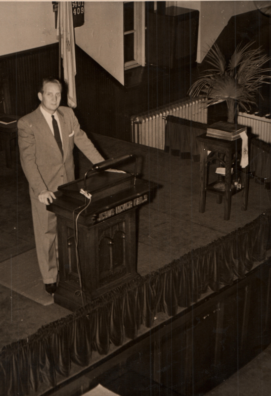 Pastor Roberson at the pulpit in the sanctuary at 19th and Green Streets