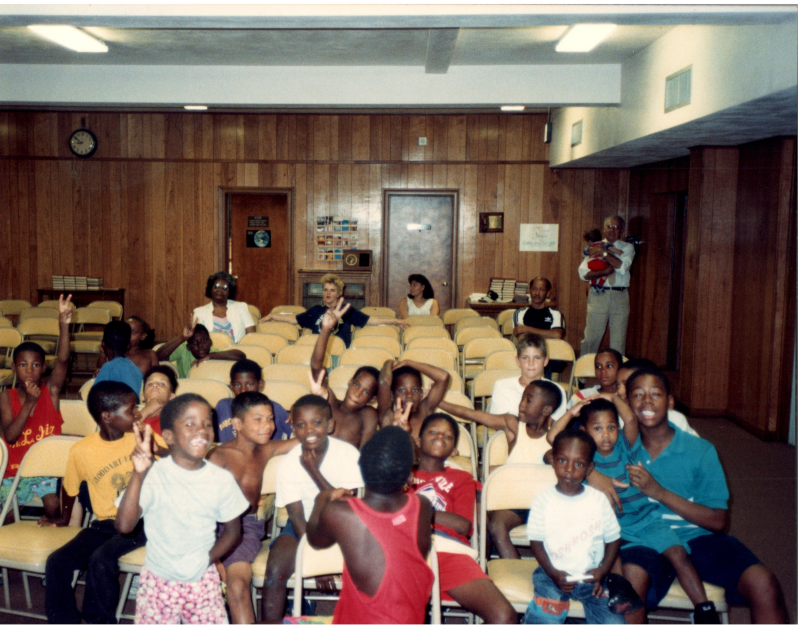 Children smile for a photo