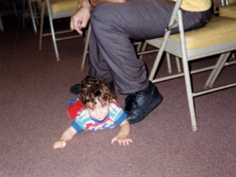 A boy crawls on the ground