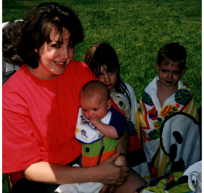 Susan Ogden holding Stephen Ogden with Danielle and Grant in the background