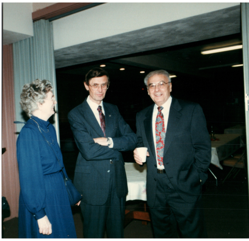Pastor Bogdan speaks with a man and woman