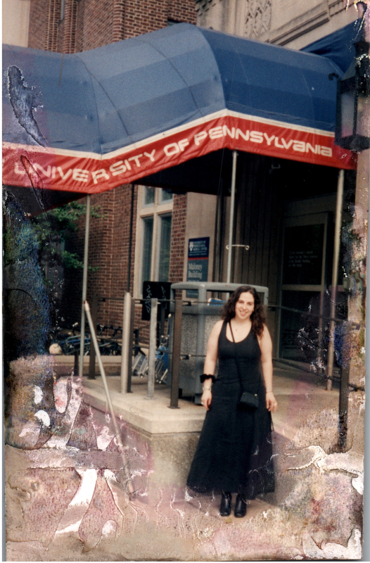 A woman stands outside of a University of Pennsylvania building