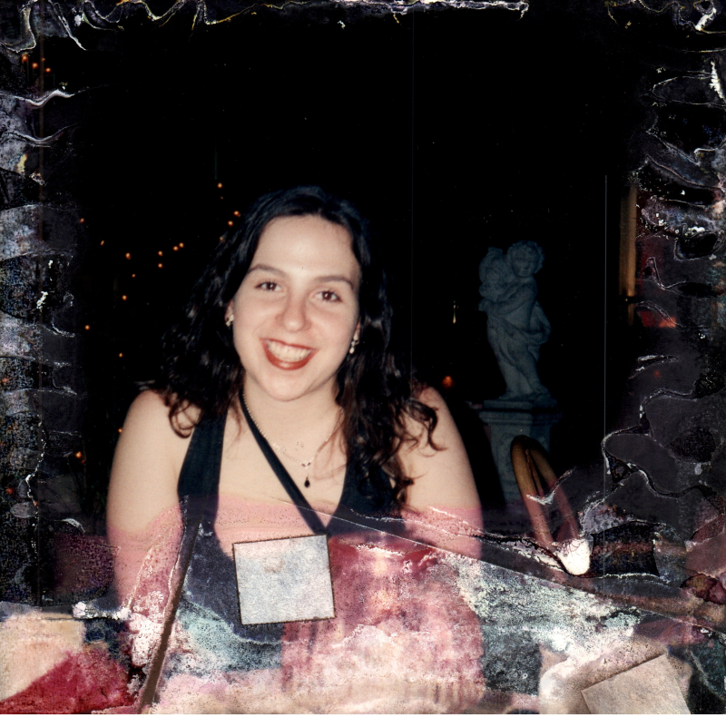 A woman smiles for a photograph