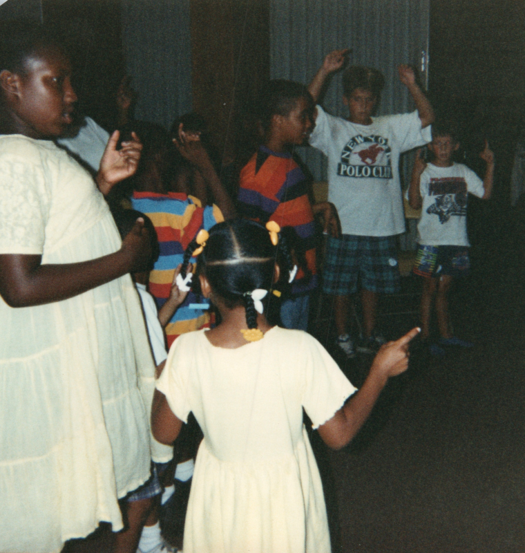 Children stand in a circle