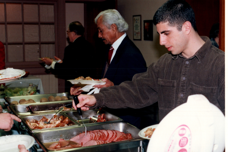 Congregants serve themselves from a buffet
