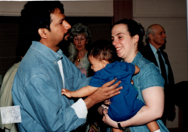 Paul picks up his son, Johnathan Nikhil Paul