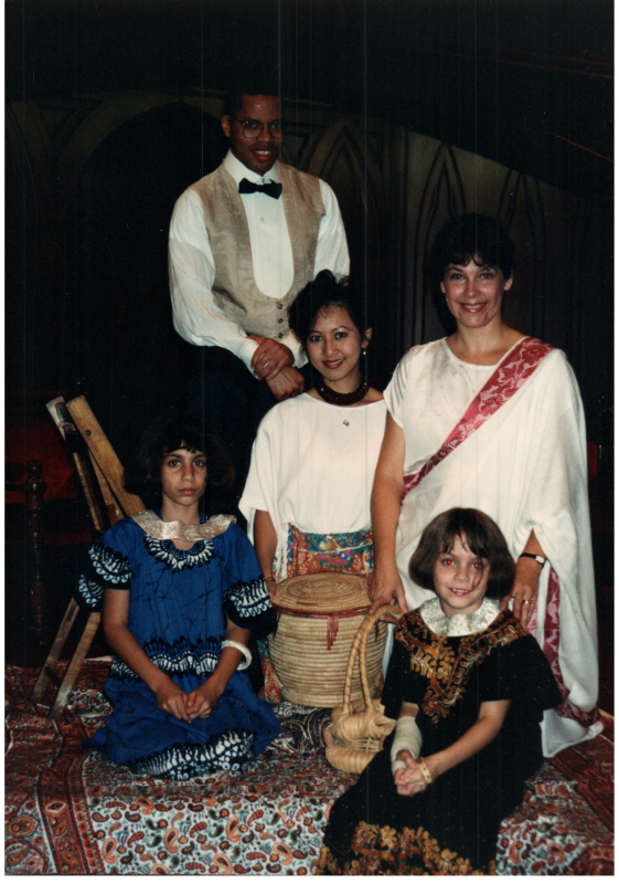 Congregants, including Otis A. Fortenberry and Ginny Vega, dress in international clothing