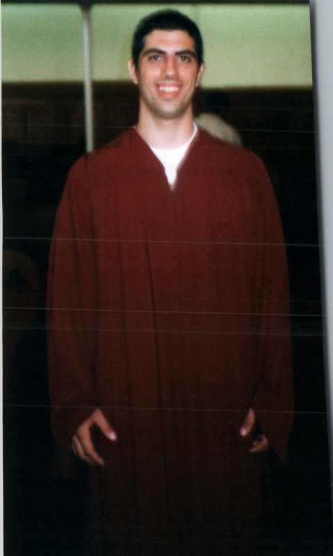 Young man in a baptism gown