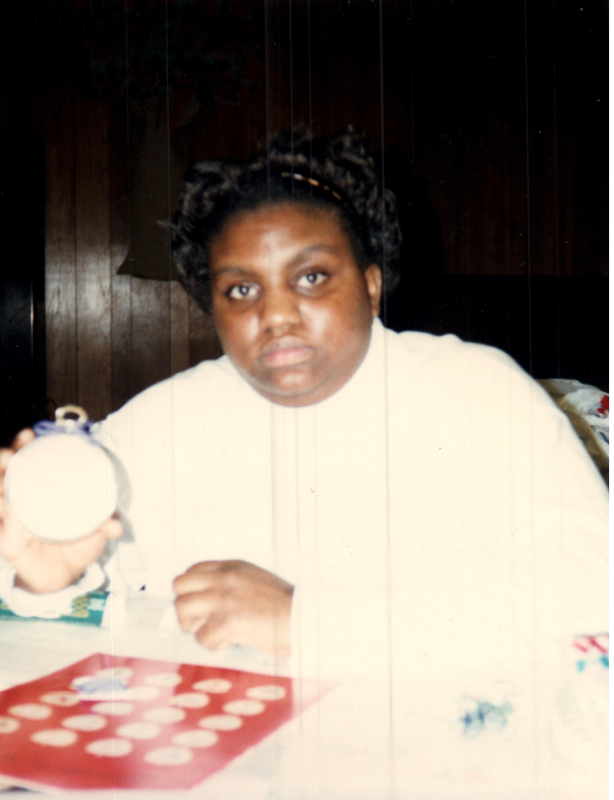 A woman holds up a craft at the Bible Study's "The I AMs"