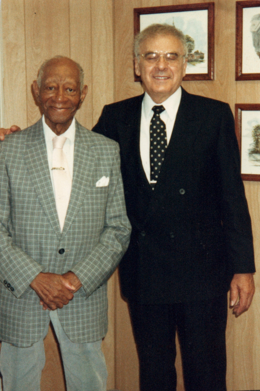 Pastor Bogdan smiles with a man