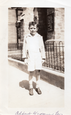 A young boy stands outside the church at 19th and Green streets