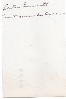Provides the family name of the couple in the photo (illegible)