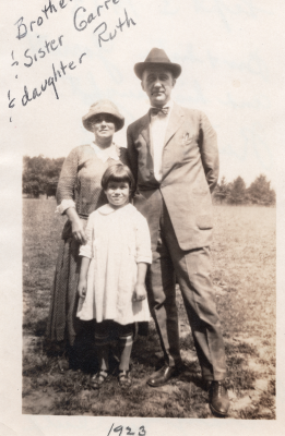 Brother and Sister Garret pose together with their daughter, Ruth