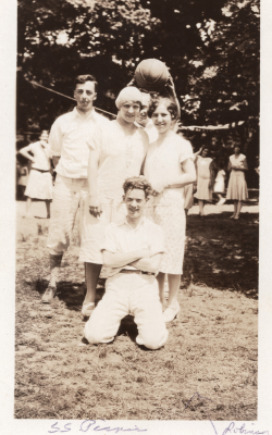 Fred and Gladys Hopeworth, Hester Laffery, and Bill Roberson smile together with a basketball on a field