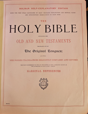 Title page: "Homan Self-Explanatory Edition, with the text fully elucidated by many thousand explanatory and critical notes and introductory observations on each book, The Holy Bible, containing the Old and New Testaments, translated out of The Original Tongues; and with the former translations diligently compariedand revised, the text conformable to that of the edition of 1611, commonly known as the authorized or King James' Version, Marginal References." Text sits above a crest reading, "Let there be light"