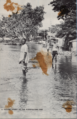 A picture captioned, "A Village as the Floodwaters Rise"